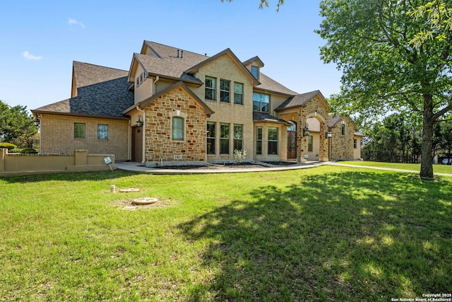 125 Creek Spgs, Boerne, TX 78006 - rear view of property with fence, a yard, and a shingled roof