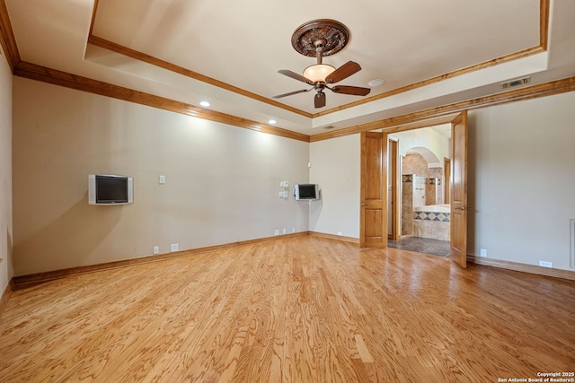 125 Creek Spgs, Boerne, TX 78006 - empty room with a tray ceiling, a ceiling fan, visible vents, ornamental molding, and arched walkways