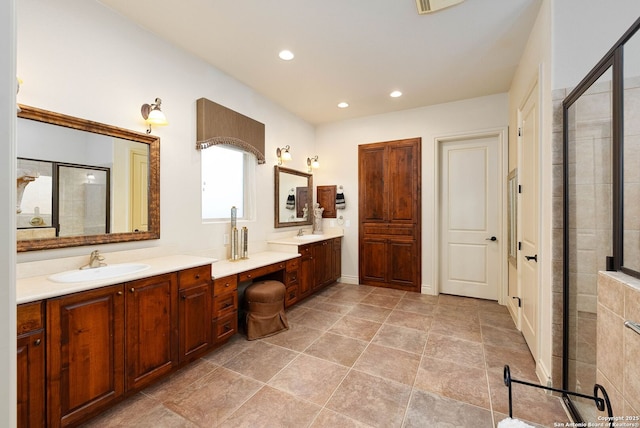 bathroom with a stall shower, double vanity, a sink, and recessed lighting