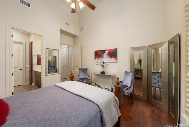 bedroom with visible vents, high vaulted ceiling, and ensuite bath