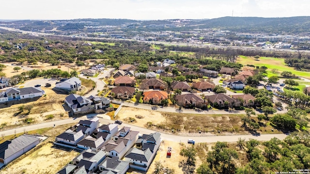 bird's eye view featuring a residential view and a mountain view