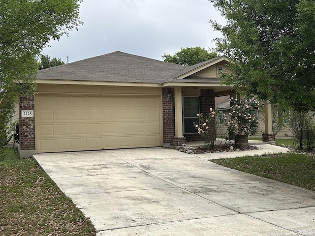 single story home with a garage, brick siding, a porch, and driveway
