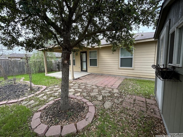 back of property with a patio and fence