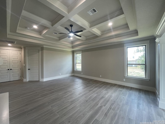 unfurnished bedroom with ornamental molding, coffered ceiling, and visible vents