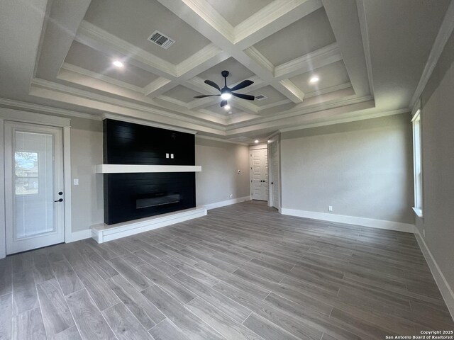 unfurnished living room with visible vents, ceiling fan, coffered ceiling, baseboards, and a glass covered fireplace