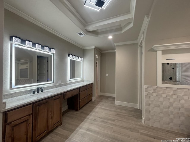 bathroom with crown molding, visible vents, walk in shower, wood finished floors, and vanity