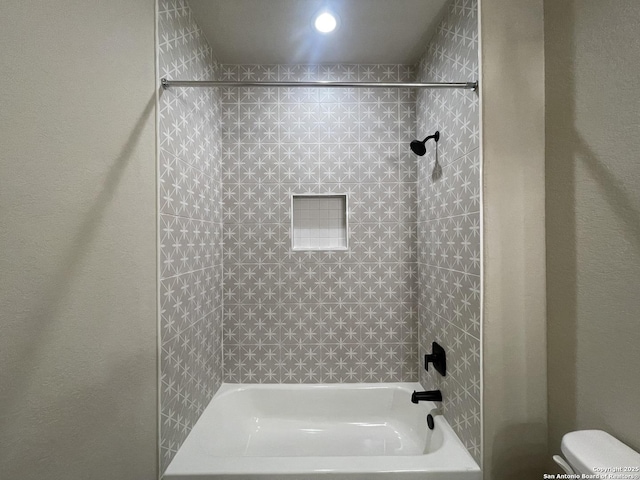 bathroom featuring toilet and shower / bath combination
