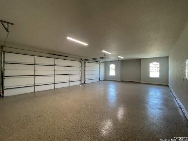 garage featuring baseboards