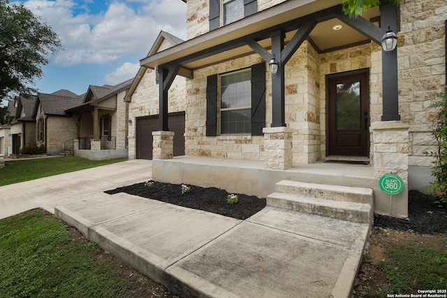 723 Decathlon, San Antonio, TX 78245 - property entrance featuring an attached garage, a porch, concrete driveway, and stone siding