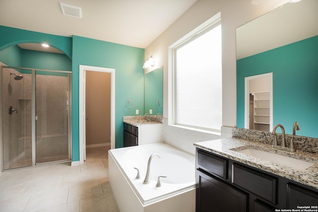 723 Decathlon, San Antonio, TX 78245 - bathroom with two vanities, a garden tub, a stall shower, and a sink