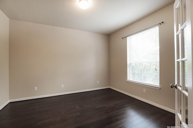 723 Decathlon, San Antonio, TX 78245 - unfurnished room with dark wood-style floors and baseboards