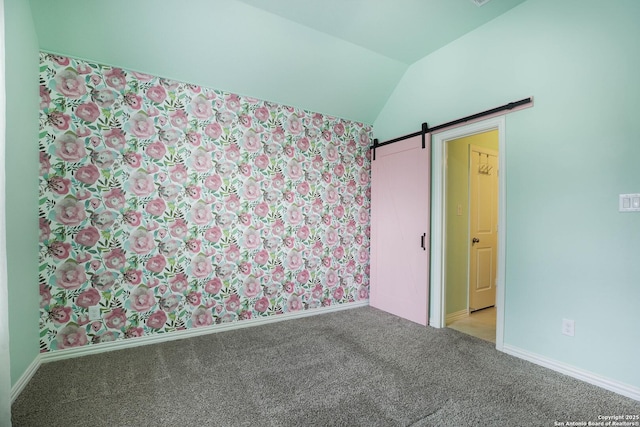 723 Decathlon, San Antonio, TX 78245 - carpeted empty room with baseboards, a barn door, and lofted ceiling