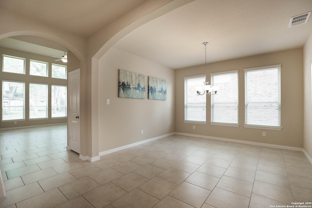 723 Decathlon, San Antonio, TX 78245 - unfurnished dining area with light tile patterned floors, visible vents, baseboards, arched walkways, and ceiling fan with notable chandelier