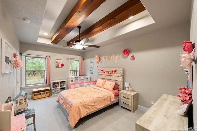 bedroom with light tile patterned floors, a ceiling fan, and baseboards