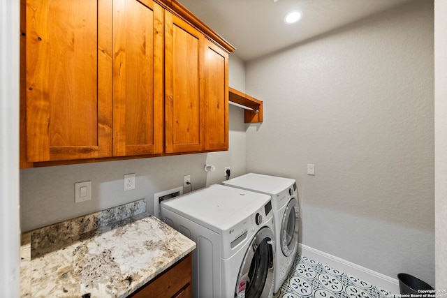 clothes washing area with recessed lighting, cabinet space, washing machine and dryer, light tile patterned flooring, and baseboards