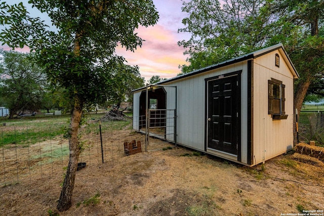 view of outdoor structure with an outdoor structure and fence