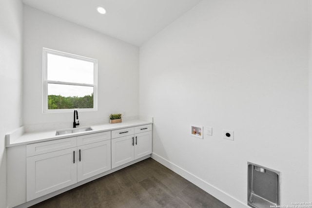 265 Vaquero Dr, Pipe Creek, TX 78063 - laundry area with hookup for an electric dryer, cabinet space, washer hookup, baseboards, and dark wood-type flooring