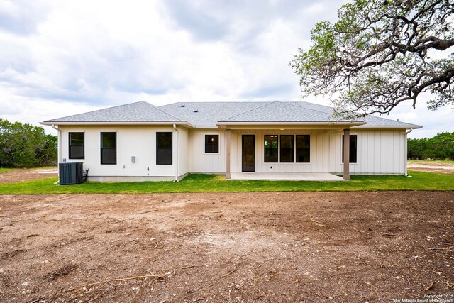 265 Vaquero Dr, Pipe Creek, TX 78063 - back of house featuring a patio, cooling unit, a shingled roof, and driveway
