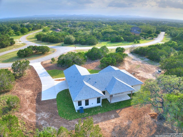 265 Vaquero Dr, Pipe Creek, TX 78063 - view of subject property featuring a forest