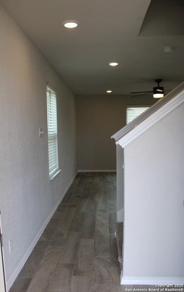 hallway with baseboards and recessed lighting