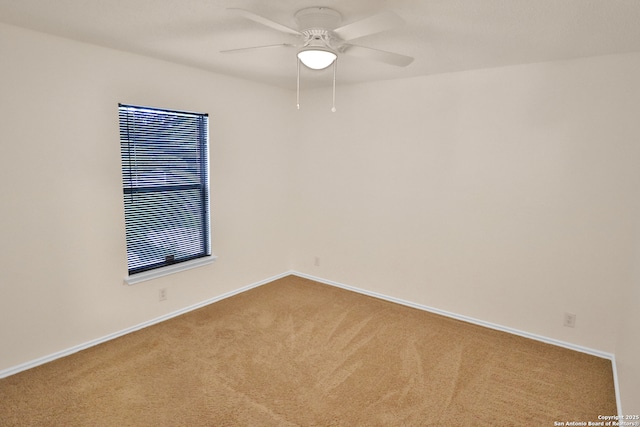 unfurnished room with ceiling fan, carpet floors, and baseboards