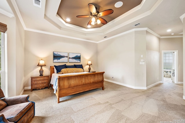 carpeted bedroom featuring visible vents, a raised ceiling, and recessed lighting