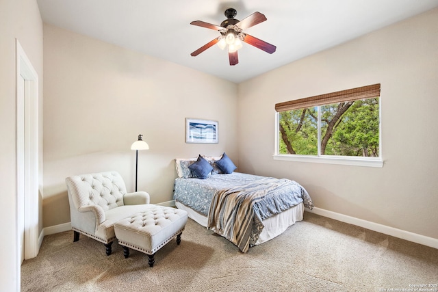 bedroom with ceiling fan, carpet floors, and baseboards