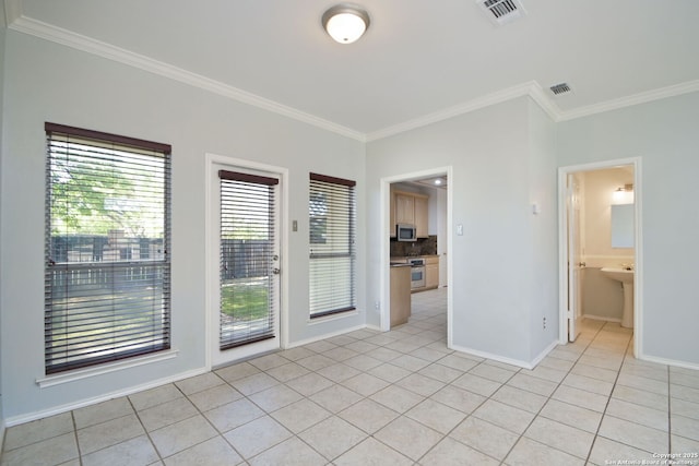 6530 Lochglen, San Antonio, TX 78240 - empty room with baseboards, visible vents, light tile patterned floors, and crown molding