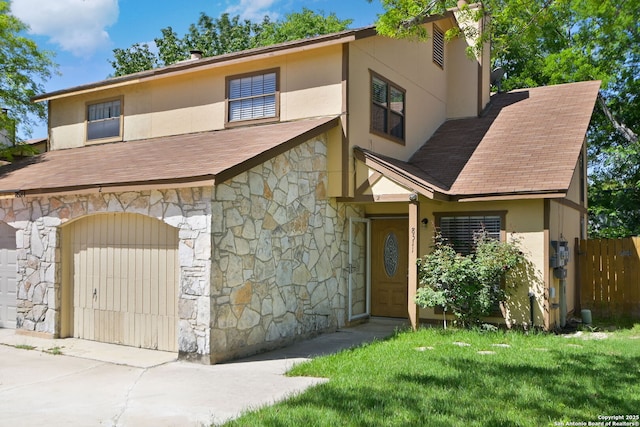 view of front of house featuring fence, roof with shingles, and stone siding