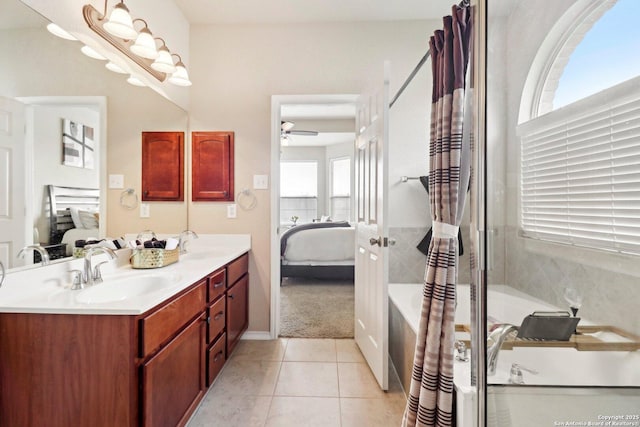 ensuite bathroom featuring double vanity, ensuite bathroom, a ceiling fan, and a sink