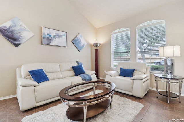 tiled living room with vaulted ceiling and baseboards