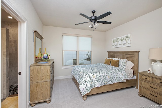 bedroom featuring baseboards, a ceiling fan, and light carpet