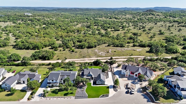 birds eye view of property with a residential view and a forest view