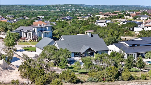 birds eye view of property with a residential view