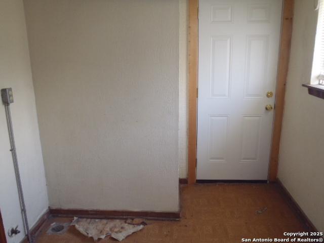 interior space featuring baseboards