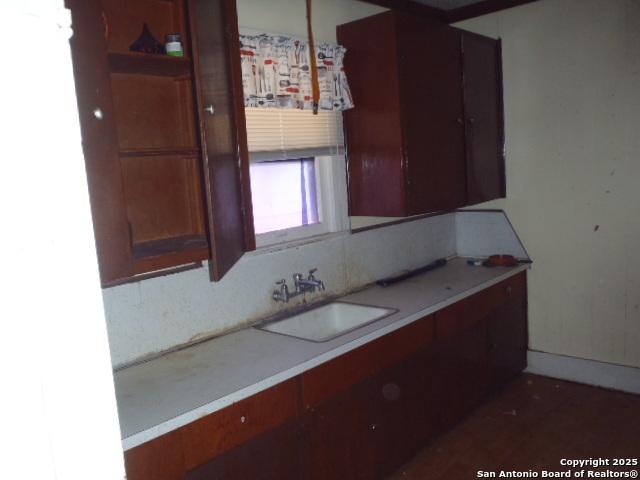 kitchen with a sink and light countertops