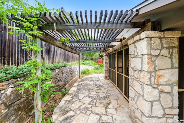 view of patio with a pergola and a fenced backyard