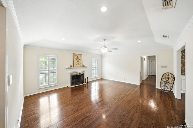 unfurnished living room featuring crown molding, visible vents, and a wealth of natural light