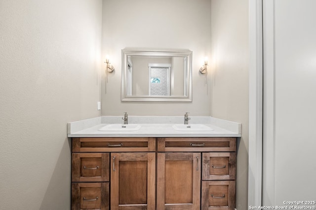 bathroom featuring double vanity and a sink