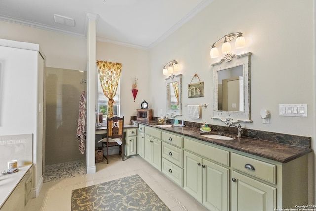 bathroom with tiled shower, double vanity, ornamental molding, and a sink
