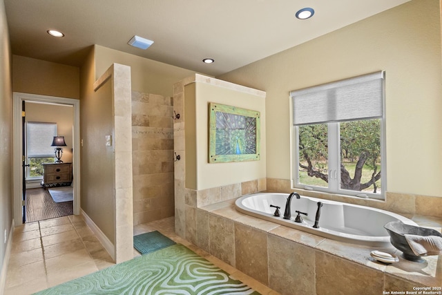 full bath featuring tile patterned floors, recessed lighting, a walk in shower, and a garden tub
