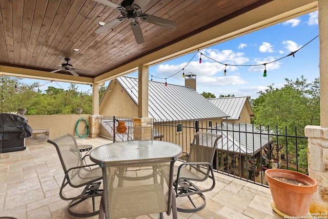 view of patio / terrace featuring area for grilling and a ceiling fan