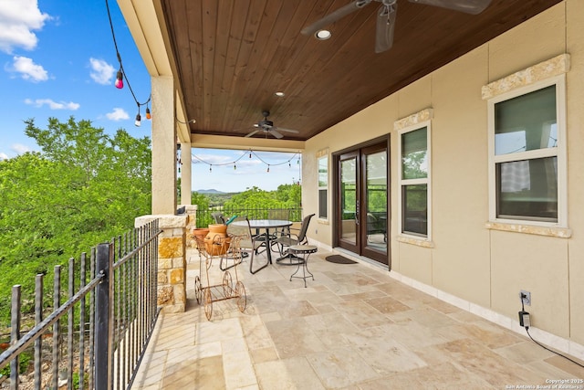 view of patio / terrace with a ceiling fan and outdoor dining space