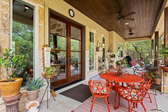 view of patio featuring ceiling fan and french doors