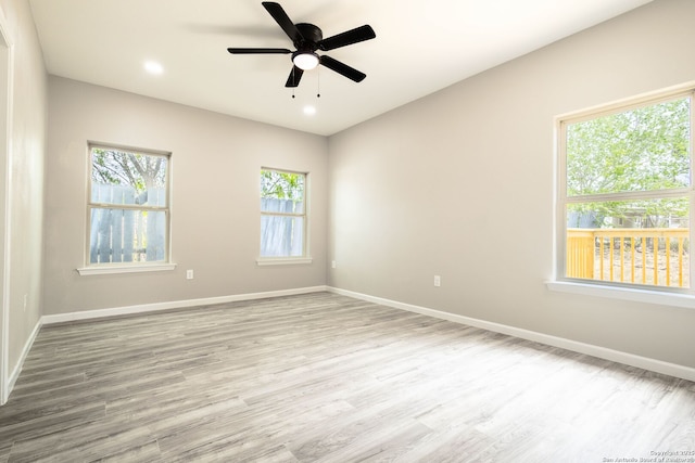 908 Plum, Floresville, TX 78114 - unfurnished room featuring baseboards, wood finished floors, and ceiling fan