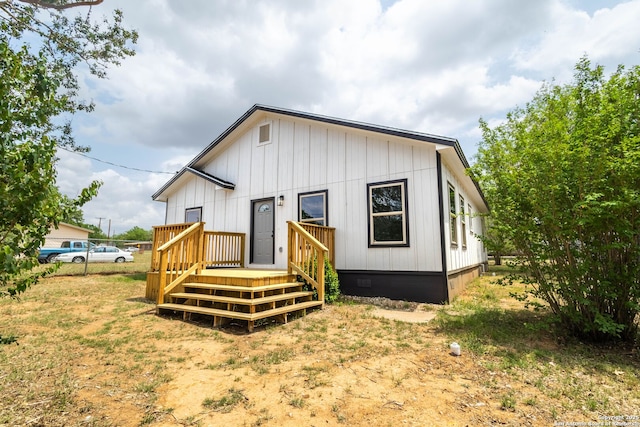 908 Plum, Floresville, TX 78114 - rear view of property with crawl space and a wooden deck
