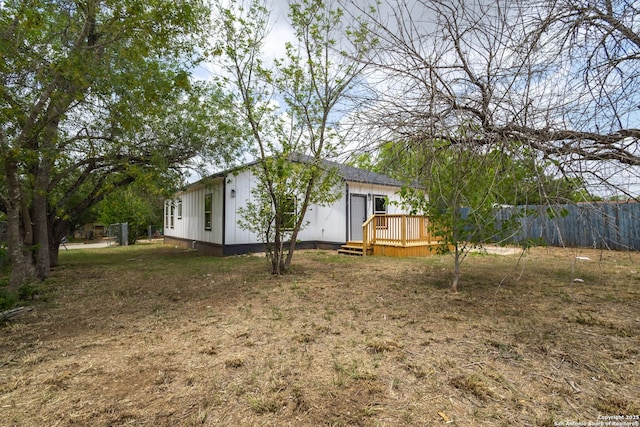 908 Plum, Floresville, TX 78114 - view of yard with a wooden deck and fence