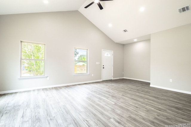 908 Plum, Floresville, TX 78114 - unfurnished living room featuring a wealth of natural light, visible vents, ceiling fan, and high vaulted ceiling