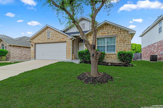 traditional home featuring driveway, a front yard, an attached garage, and stone siding
