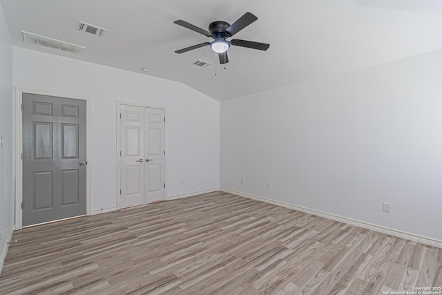 unfurnished room with visible vents, ceiling fan, and light wood-style floors